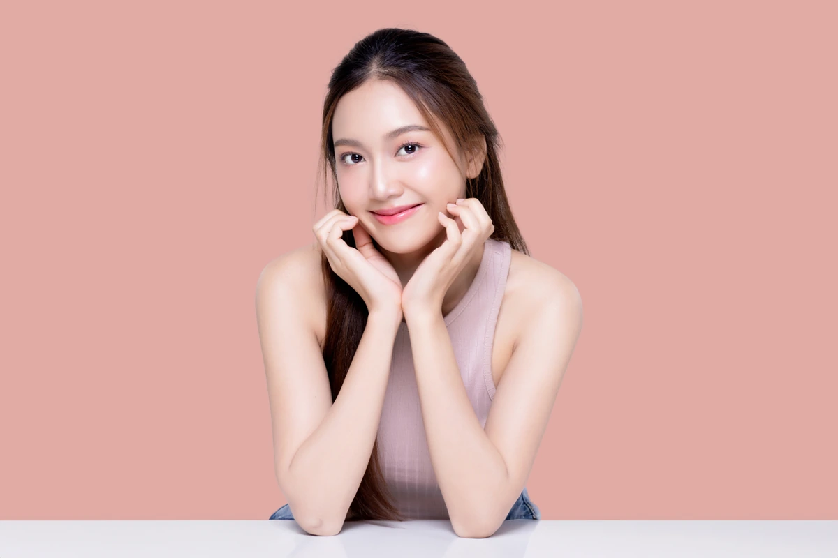 Beautiful,Young,Asian,Woman,With,Healthy,And,Perfect,Skin,On cosmetic dentist Paso Robles
