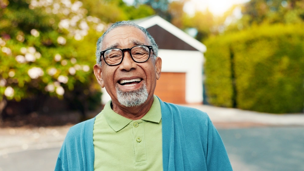 Older man smiling at the camera